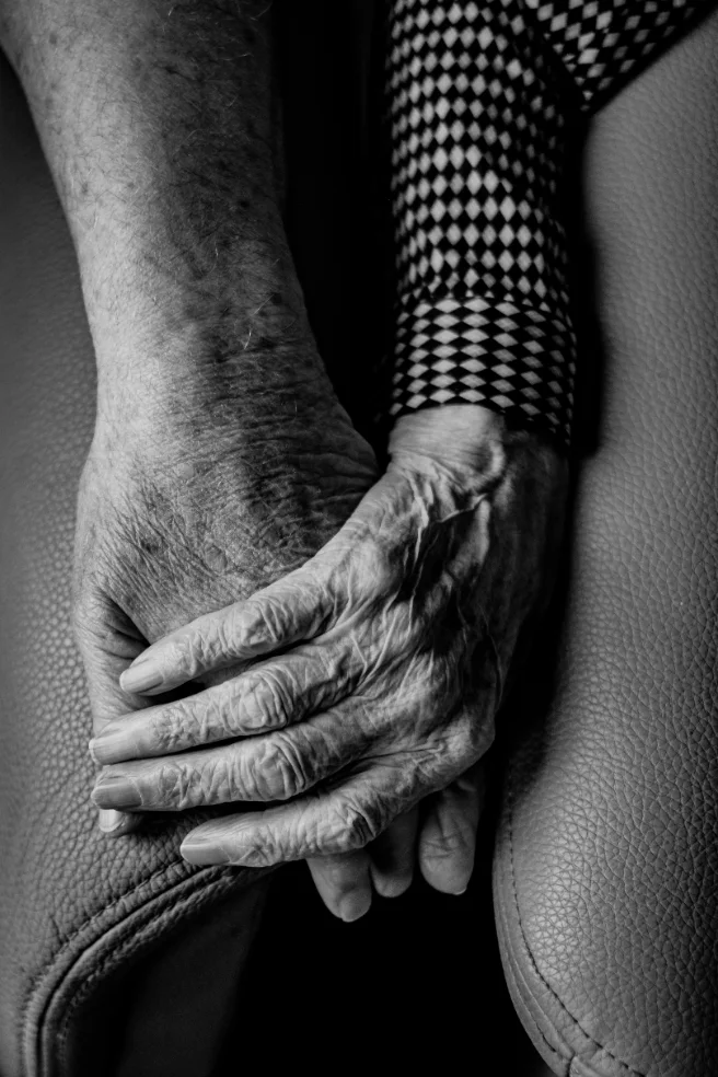 A family caregiver at home with an aging parent